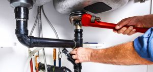 What is the role of a sump pump in a residential plumbing system?